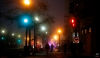 Pedestrians walk in a morning fog on 17th Street and Pennsylvania Avenue NW across from the Eisenhower Executive Office Building in Washington, Wednesday, Jan. 15, 2014. A dense fog has caused limited visibility in the Washington area. (AP Photo/Charles Dharapak)