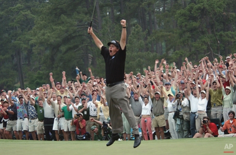 Phil Mickelson celebrates after winning the Masters golf tournament at the Augusta National Golf Club in Augusta, Ga., in this April 11, 2004 photo. (AP Photo/Dave Martin)