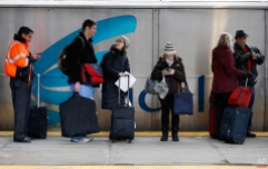 Passengers wait to board an Acela train at South Station in Boston, Wednesday, Nov. 26, 2014. Rain and snow rolled into the Northeast on Wednesday as millions of Americans made the big Thanksgiving getaway, grounding hundreds of flights and turning highways sloppy along the congested Washington-to-Boston corridor. (AP Photo/Michael Dwyer)