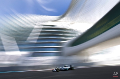 Mercedes driver Nico Rosberg of Germany steers his car during the first free practice at the Yas Marina racetrack in Abu Dhabi, United Arab Emirates, Friday, Nov. 21, 2014. The Emirates Formula One Grand Prix will take place on Sunday. (AP Photo/Hassan Ammar)