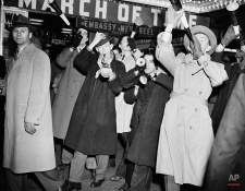 Revelers wend their way in New York's Times Square to ring in the New Year, Jan. 1, 1942. An estimated half million turned out to celebrate. (AP Photo/Matty Zimmerman)