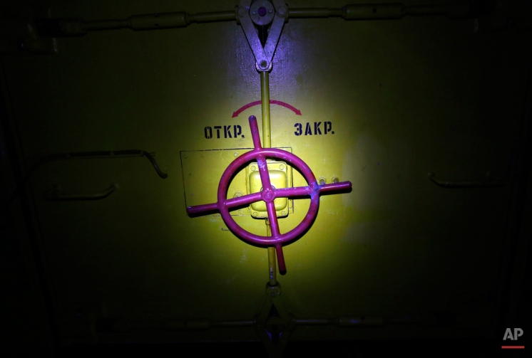 This photo taken Friday, Nov. 7, 2014 shows a door to a nuclear storage bunker inside an abandoned ex-Soviet military base near Nagyvazsony, Hungary. (AP Photo/Darko Vojinovic)