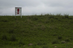 In this June 20, 2014 photo, an exclamation point punctuates a long propaganda slogan in a field in North Korea's North Hamgyong province. The Associated Press was granted permission to embark on a weeklong road trip across North Korea to the country's spiritual summit Mount Paektu. The trip was on North Korea's terms. An AP reporter and photographer couldn't interview ordinary people or wander off course, and government "minders" accompanied them the entire way. (AP Photo/David Guttenfelder)