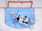 San Jose Sharks goalie Antti Niemi, of Finland, is scored on by Los Angeles Kings center Tyler Toffoli during the first period of an NHL hockey game, Saturday, Dec. 27, 2014, in Los Angeles. (AP Photo/Mark J. Terrill)