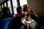 Eddie Wilson, 65, puts on his glasses while riding the ferry from the mainland to attend a church service for the 129th anniversary of St. Luke Baptist Church on Sapelo Island, Ga. on Sunday, June 9, 2013. Isolated over time to the Southeast's barrier islands, the Geechee of Georgia and Florida, otherwise known as Gullah in the Carolinas, have retained their African traditions more than other African American communities in the U.S. (AP Photo/David Goldman)