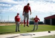 Cincinnati Reds' Mike Leake measures how high he can jump during the baseball team's first practice for pitchers and catchers at spring training this season, Thursday, Feb. 19, 2015, in Goodyear, Ariz. (AP Photo/John Locher)