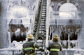 Philadelphia firefighters work the scene of an overnight blaze in west Philadelphia, Monday Feb. 16, 2015, as icicles hang from where the water from their hoses froze. Bone-chilling, single digit temperatures have gripped the region, prompting the closure of all parish and regional Catholic elementary schools in the city of Philadelphia. (AP Photo/Jacqueline Larma)