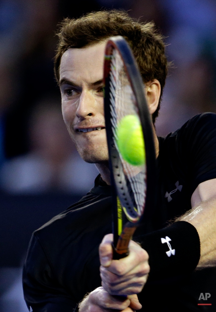 Andy Murray of Britain makes a backhand return to Nick Kyrgios of Australia during their quarterfinal match at the Australian Open tennis championship in Melbourne, Australia, Tuesday, Jan. 27, 2015. (AP Photo/Lee Jin-man)