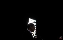 Democratic presidential candidate, Sen. Barack Obama, D-Ill., is silhouetted as he speaks at a rally in Norfolk, Va., on Oct. 28, 2008. (AP Photo/Jae C. Hong)