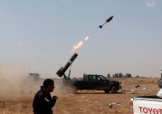 Iraqi security forces launch a rocket against Islamic State extremist positions during clashes in Tikrit, 130 kilometers (80 miles) north of Baghdad, Iraq, Monday, March 30, 2015. (AP Photo/Khalid Mohammed)