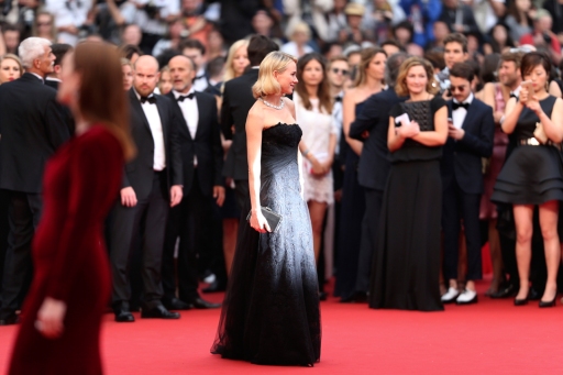 Actress Naomi Watts, center, poses for photographers as she arrives for the screening of the film "Mad Max: Fury Road" at the 68th international film festival, Cannes, southern France, Thursday, May 14, 2015. (AP Photo/Thibault Camus)