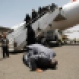 A Yemeni man, who was stranded in Egypt after conflict broke out in Yemen, prays and kisses the ground after arriving at Sanaa airport, Yemen, Wednesday, May 20, 2015. (AP Photo/Hani Mohammed)