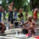 Ethnic Rohingya men clean their clothes and bathe near a temporary shelter in Langsa, Aceh province, Indonesia, Friday, May 22, 2015. Thousands of refugees and migrants have washed ashore in Malaysia, Indonesia and Thailand, about half Rohingya and the rest from Bangladesh, according to the International Organization for Migration. (AP Photo/Tatan Syuflana)