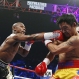 Floyd Mayweather Jr., left, connects with a right to the head of Manny Pacquiao, from the Philippines, during their welterweight title fight on Saturday, May 2, 2015 in Las Vegas. (AP Photo/John Locher)