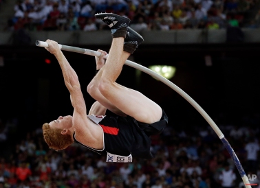 Canada's Shawnacy Barber competes in the men’s pole vault final at the World Athletics Championships at the Bird's Nest stadium in Beijing, Monday, Aug. 24, 2015. (AP Photo/Andy Wong)