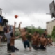 Filipino boys play basketball in floodwaters from a swollen creek at a coastal village in Malabon, north of Manila, Philippines, Wednesday, July 8, 2015. Typhoon Chan-Hom passing over the northeastern waters of the Philippines heading to northern Taiwan has enhanced the seasonal monsoon, dumping heavy rains over the capital, Manila, and the northern provinces. (AP Photo/Aaron Favila)