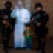 In this July 10, 2015 photo, Jair Ortega, age three, poses for a street photographer next to police special forces and a life-size cut out figure of Pope Francis, after the departure of the pope from Palmasola prison in Santa Cruz, Bolivia. Jair's mother asked the officers to pose with her son, saying he wants to be a police officer when he grows up. (AP Photo/Rodrigo Abd)