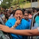Parliamentary candidate Mahinda Rajapaksa gestures outside a polling station after casting his vote in Medamulana village, southern Sri Lanka, Monday, Aug. 17, 2015. Rajapaksa, who was Sri Lanka's leader for nine years until his Jan. 8 presidential election defeat to a former ally, is running for prime minister, a position that is second to that of president. (AP Photo/Eranga Jayawardena)
