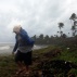 A man walks on the shore against strong winds backdropped by a rough sea as Tropical Storm Erika moves away from the area in Guayama, Puerto Rico, Friday, Aug. 28, 2015. The storm was expected to dump up to 8 inches of rain across the drought-stricken northern Caribbean as it carved a path toward the U.S. (AP Photo/Ricardo Arduengo)