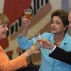 German Chancellor Angela Merkel, left, shares a toast with Brazil's Supreme Court President Ricardo Lewandowski and President Dilma Rousseff, during lunch at the Itamaraty Palace in Brasilia, Brazil, Thursday, Aug. 20, 2015. Merkel made a two-day stop to boost ties with Brazil. She also plans to meet with German business representatives before heading back home on Thursday. (AP Photo/Eraldo Peres)