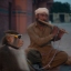 A Pakistani monkey handler Naseer Khan plays flute to attract passers by for a monkey show to earn his living in Islamabad, Pakistan, Monday, Sept. 7, 2015. (AP Photo/B.K. Bangash)