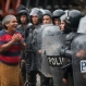 A woman pleads for the release of two residents who were detained by police during clashes in El Limon, Nicaragua, Saturday, Oct. 17, 2015. Riot police clashed with striking workers demanding the reinstatement of fired employees from the Canadian mining company B2Gold. By midday Saturday, police had not said how many people were arrested or injured, but witnesses saw two police officers bleeding after being hit by rocks and two local residents being arrested for not leaving street blockades. (AP Photo/Esteban Felix)