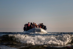 Refugees and migrants approach the Greek island of Lesbos on a dinghy after crossing the Aegean sea from the Turkish coast, on Monday, Dec. 7, 2015. Greece is the main point of entry into the EU for people fleeing war and poverty at home, with the vast majority of the 700,000 people who have entered the country this year reaching Greek islands from the nearby Turkish coast. (AP Photo/Santi Palacios)