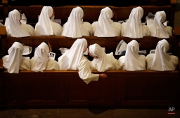 Nuns sit in their pews while waiting for Pope Francis to arrive inside the Basilica of the National Shrine of the Immaculate Conception Wednesday, Sept. 23, 2015, in Washington. (AP Photo/David Goldman)