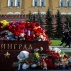 The Kremlin guards pass flowers and toys laid at the memorial stone with the word Leningrad (St. Petersburg) at the Tomb of the Unknown Soldier outside Moscow's Kremlin Wall in Moscow, Tuesday, Nov. 3, 2015. Mourners have been coming to St. Petersburg's airport and other places since Saturday with flowers, pictures of the victims, stuffed animals and paper planes. Metrojet's Airbus A321-200 en route from Egypt's Sharm el-Sheikh to St. Petersburg crashed over the Sinai Peninsula on Saturday, killing all 224 on board. (AP Photo/Pavel Golovkin)