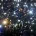 Thousands of people hold up the glowing displays of their mobile phones during a demonstration initiated by the Alternative for Germany (AfD) party against what they call the uncontrolled immigration and asylum abuse in Erfurt, central Germany, Wednesday, Nov. 4, 2015. (AP Photo/Jens Meyer)