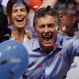 Opposition presidential candidate Mauricio Macri and his wife Juliana Awada, back left, celebrate after winning a runoff presidential election in Buenos Aires, Argentina, Sunday, Nov. 22, 2015. Macri won Argentina's historic runoff election against ruling party candidate Daniel Scioli, putting an end to the era of President Cristina Fernandez, who along with her late husband dominated Argentine politics for 12 years. (AP Photo/Ricardo Mazalan)