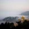 Fog forms beneath the Gorny Convent of the Russian Orthodox Church in Ein Kerem, an ancient village near Jerusalem Sunday. Nov. 8, 2015. (AP Photo/Dusan Vranic)