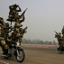 Daredevils of Border Security Force display their skill on motorcycles during golden jubilee celebrations of their raising day in New Delhi, India, Tuesday, Dec. 1, 2015. The BSF is a paramilitary force that guards India's land border during peace time and prevents transnational crime. (AP Photo/Manish Swarup)