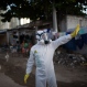 In this Jan. 26, 2016 photo, a municipal worker gestures during an operation to combat the Aedes aegypti mosquitoes that transmits the Zika virus in Recife, Pernambuco state, Brazil. Brazil's health minister Marcelo Castro says the country is sending some 220,000 troops to battle the mosquito blamed for spreading a virus suspected of causing birth defects, but he also says the war is already being lost. (AP Photo/Felipe Dana)