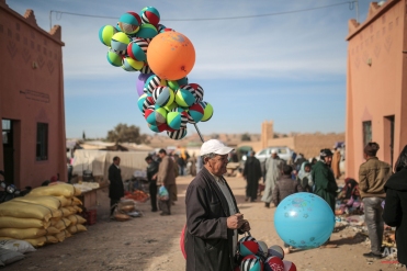 A balloon seller waits for customers in the weekly market of Kalaat M'Gouna, a town in Ouarzazate, Morocco, Wednesday, Feb. 3, 2016. (AP Photo/Mosa'ab Elshamy)