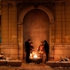 A group of tourists warm themselves up near the flame in front of monument to the fallen in World War II, in Sarajevo, Bosnia, on Monday, Jan. 4, 2016. Over the past two days, the snow has reached about 30 cm in height and has caused delays for traffic, and daytime temperatures dropped to - 8 Celsius (17.6 Fahrenheit). (AP Photo/Amel Emric)