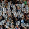 Napoli supporters hold up prints of Napoli defender Kalidou Koulibaly's portrait in his support ahead of a Serie A soccer match between Napoli and Carpi, at the San Paolo stadium in Naples, Italy, Sunday, Feb. 7, 2016. Last week during the team's game against Lazio the match was suspended for four minutes because of racist chants from Lazio fans against Koulibaly. (AP Photo/Salvatore Laporta)