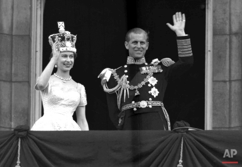 This is a June. 2, 1953 photo of Britain's Queen Elizabeth II and Prince Philip, Duke of Edinburgh, as they wave to supporters from the balcony at Buckingham Palace, following her coronation at Westminster Abbey, London. (AP Photo/Leslie Priest)