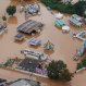 In this March 11, 2016 aerial photo, an amusement park is surrounded by flood water in Franco da Rocha, in the greater Sao Paulo area, Brazil. Brazilian officials say mudslides and flooding caused by heavy downpours killed at least 16 people including a 4-year-old boy in low income neighborhoods on the outskirts of Sao Paulo. (AP Photo/Andre Penner)