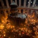 Christian Orthodox pilgrims hold candles during a Holy Fire ceremony in the church of the Holy Sepulchre, traditionally believed to be the burial site of Jesus Christ, Saturday, April 30, 2016 in Jerusalem. Thousands of Christians have gathered in Jerusalem for the ancient fire ceremony that celebrates Jesus' resurrection. (AP Photo/Dusan Vranic)