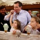 Republican presidential hopeful Sen. Ted Cruz eats a cherry from his daughter's Catherine ice cream sundae as Caroline, right, enjoys hers during a campaign stop at Zaharakos Ice Cream Parlor in Columbus, Ind., Monday, April 25, 2016. (AP Photo/Michael Conroy)