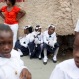 Parishioners rest during a pause for prayer in a procession marking the feast of Corpus Christi in Port-au-Prince, Haiti, Thursday, May 26, 2016. Corpus Christi celebrates the tradition and belief of the Holy Eucharist, which for Christians represents the body and blood of Jesus Christ. (AP Photo/Dieu Nalio Chery)