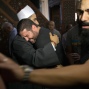 The Imam of al Thawrah Mosque, Samir Abdel Bary, gives condolences to Tarek Abu Laban, center, who lost four relatives, all victims of Thursday's EgyptAir plane crash, attends prayers for the dead, at al Thawrah Mosque, in Cairo, Egypt, Friday, May 20, 2016. The Airbus A320 plane was flying from Paris to Cairo with 66 passengers and crew when it disappeared early Thursday over the Mediterranean Sea. (AP Photo/Amr Nabil)