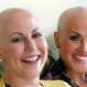 Annette Page, left, and her sister Sharee Page, pose for a photograph at Sharee's home during an interview, in Farmington, Utah, Thursday, May 26, 2016. The two Utah sisters have received a breast cancer diagnosis within about two weeks of one another, a coincidence that doctors say is extremely rare, but gives them the chance to undergo chemotherapy together, shave each other's heads and discuss their identical symptoms. (AP Photo/Rick Bowmer)