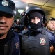 Ibar Esteban Perez Corradi, center, is escorted by police officers to a court hearing, in Asuncion, Paraguay, Tuesday, June 21, 2016. After several years on the run, the Argentine fugitive was arrested in Paraguay on Sunday. He is suspected as the mastermind of a 2008 triple murder related to trafficking ephedrine. Argentina has launched the process for his extradition to face the murder accusations. (AP Photo/Jorge Saenz)