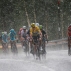 Australia’s Richie Porte, right, breaks away from the group with Britain's Chris Froome, wearing the overall leader's yellow jersey, as they climb towards Andorra Arcalis in pouring rain and hail during the ninth stage of the Tour de France cycling race over 184.5 kilometers (114.3 miles) with start in Vielha Val d'Aran, Spain, and finish in Andorra Arcalis, Andorra, Sunday, July 10, 2016. (AP Photo/Christophe Ena)